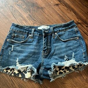 KanCan Medium Wash Distressed Denim Shorts with Leopard Pockets